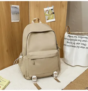 Casual minimalist canvas backpack with large capacity, ideal for students and daily use.