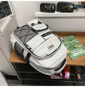 Stylish large capacity student school backpack with transparent pocket and multiple compartments.