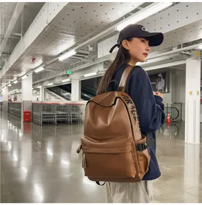 Women PU leather backpack casual brown soft waterproof school bag for daily commute and travel.