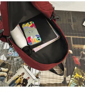 Detail view of large capacity dark red campus backpack interior capacity storage display.