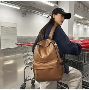 PU leather backpack for women, casual brown school bag and daily computer daypack.