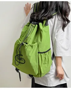 Lightweight green drawstring backpack, casual rucksack and sports daypack for outdoor travel.
