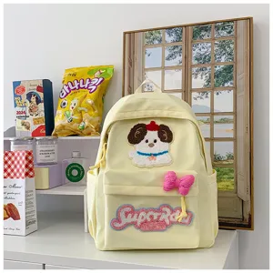 Cute Japanese style canvas backpack with dog embroidery and bow for school students.