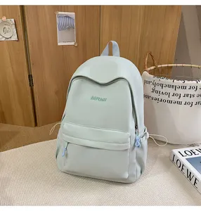 Lightweight green casual backpack for women and students, perfect for campus travel and daily use.