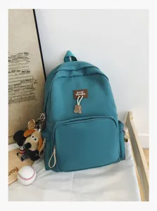 Casual solid color student backpack, large capacity campus school bag for daily use.