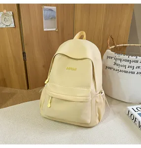 Light yellow casual school backpack detail view, soft campus style daily commuter bag.