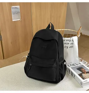 Casual black backpack detail, lightweight daily school bag for students and travel use.