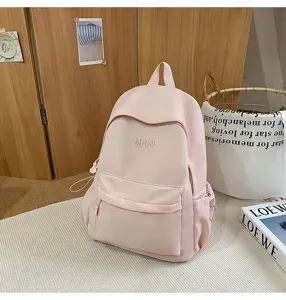 Detailed view of pink casual school backpack, lightweight daily travel bag with pocket.