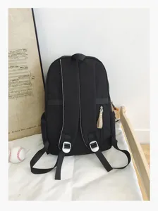 Detail view of minimal campus black backpack, casual student bookbag with large capacity.