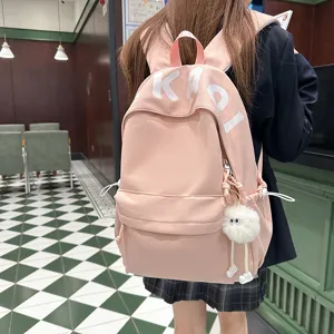 Japanese style pink canvas large capacity school backpack with cute fluffy charm for students