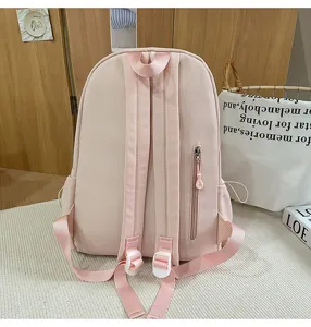 Pink Japanese style casual backpack detail, featuring back zipper pocket and adjustable straps.