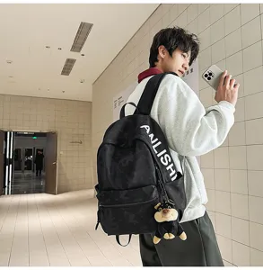Detail view of the stylish large capacity retro canvas backpack with cool letter print for students.