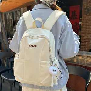 Lightweight travel backpack for women casual school bookbag with cute plush charm white