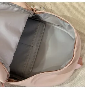 Pink casual campus backpack interior detail, lightweight school bag with multi compartments.