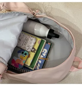 Detailed interior view of pink casual campus backpack showing spacious storage capacity.