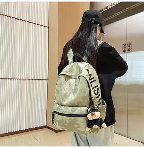 Casual green tie-dye backpack for students with cute dog pendant, spacious daily school bag.