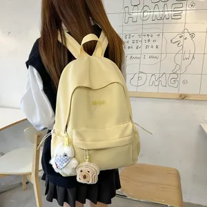 Japanese style casual campus backpack for women, lightweight travel bookbag with cute plush pendants