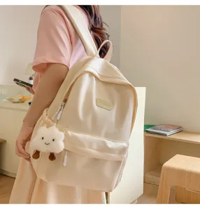 Minimalist solid color school backpack for daily use, casual student campus daypack style.