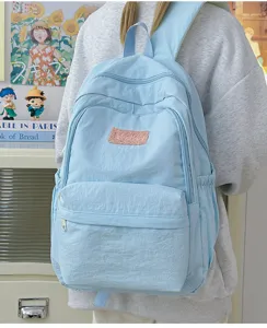 Light blue casual school backpack for students, lightweight daily daypack with multiple compartments.