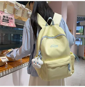 Mochila amarilla bonita para chicas bolso escolar elegante con colgante de peluche detalle