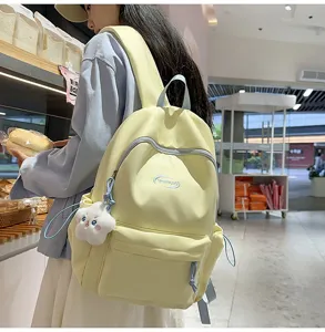 Mochila escolar amarilla casual para niñas, linda bolsa de libros estética con colgante peluche.