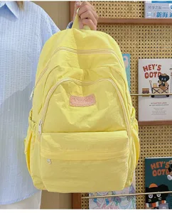 Yellow casual backpack for women, lightweight simple school book bag with multi pockets.