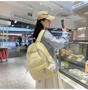 Mochila de lona casual para adolescentes linda bolsa escolar con colgante de estrella de peluche