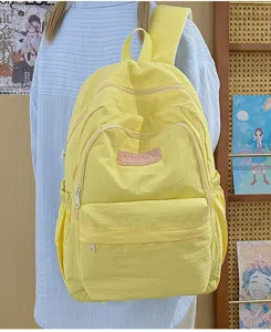 Lightweight yellow casual backpack for school girls, simple ins style daypack details.