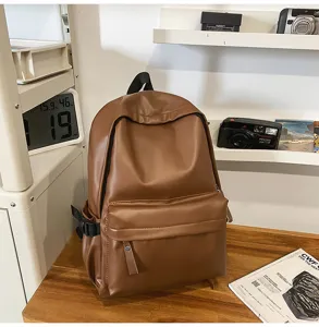 Classic brown PU leather backpack for women, minimalist daily casual school and travel bag.