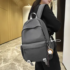 Stylish grey casual backpack for students, large capacity rucksack for daily school and travel.