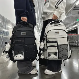 Large capacity ergonomic school backpack for students, stylish casual daypack with cute pendants