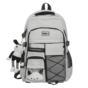 Large capacity grey student school backpack with multi pockets and cute plush doll pendant main.