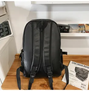 Classic black PU leather backpack for women, casual school bag and daily computer daypack.