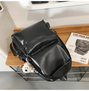 Stylish black PU leather backpack for women, casual soft daily school and travel bag.