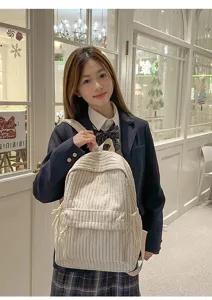 Detailed view of the stylish solid color corduroy backpack, perfect for daily school use.