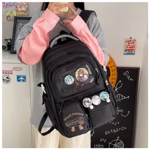Black canvas backpack for students with clear front pocket and anime badges, large capacity.