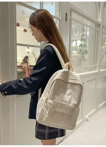 Korean style solid color corduroy backpack for women, casual school bag for students.