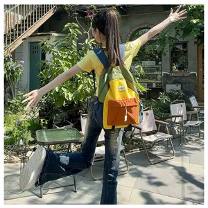 Color-blocked children casual backpack detail view, vibrant multi-color school bag for kids outdoor.