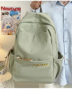 Detail view of casual large capacity student backpack with multi pockets in light green.