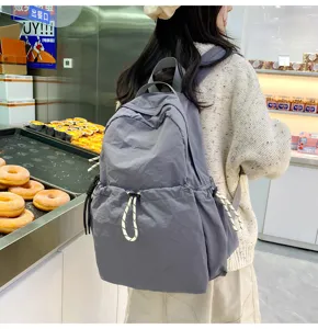 Solid color nylon casual backpack for women, large capacity daily travel bookbag detail view.