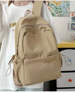 Minimalist casual large capacity backpack detail shot, durable fabric campus daily commuting bag.