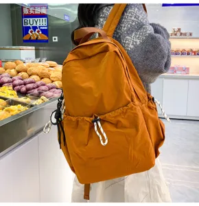 Casual solid color nylon backpack with large capacity, ideal for students and daily travel.