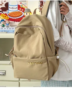 Casual large capacity canvas backpack for women, versatile student daypack with multi pockets.