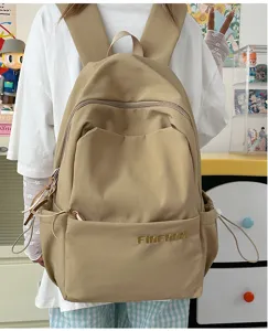 Casual khaki backpack for women, minimalist large capacity school bag for daily use.