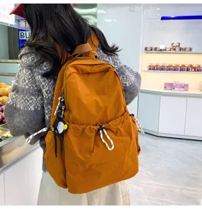 Detailed view of the solid nylon backpack, large capacity school bag and casual travel daypack.