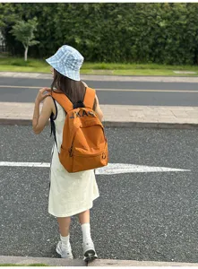 Casual Korean style college backpack for women lightweight orange school book bag daily use detail view