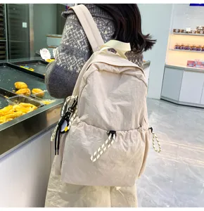 Solid color nylon backpack detail, lightweight large capacity student school bag, casual travel.