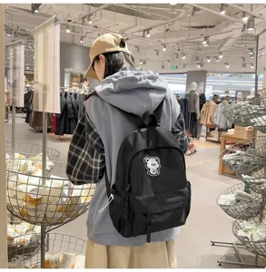 Casual black backpack for women and students, simple ins style daypack with cute bear patch.