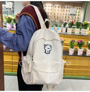 Minimalist school backpack for teen girls, cute bear patch aesthetic daypack casual bookbag.