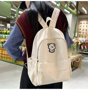 Minimalist canvas backpack for students, casual daily daypack with cute bear patch, beige.